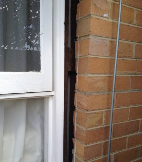 Large gap between window and brickwork caused by foundation movement